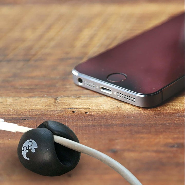 One of the clips with a phone charge wire inside the clip