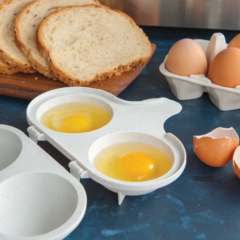 The egg poacher with two yolks in it