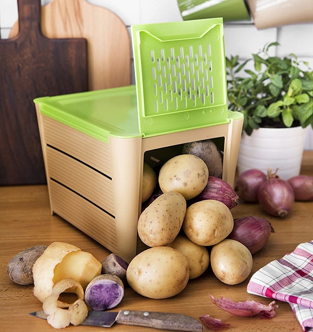 potatoes and onions inside the potato keeper