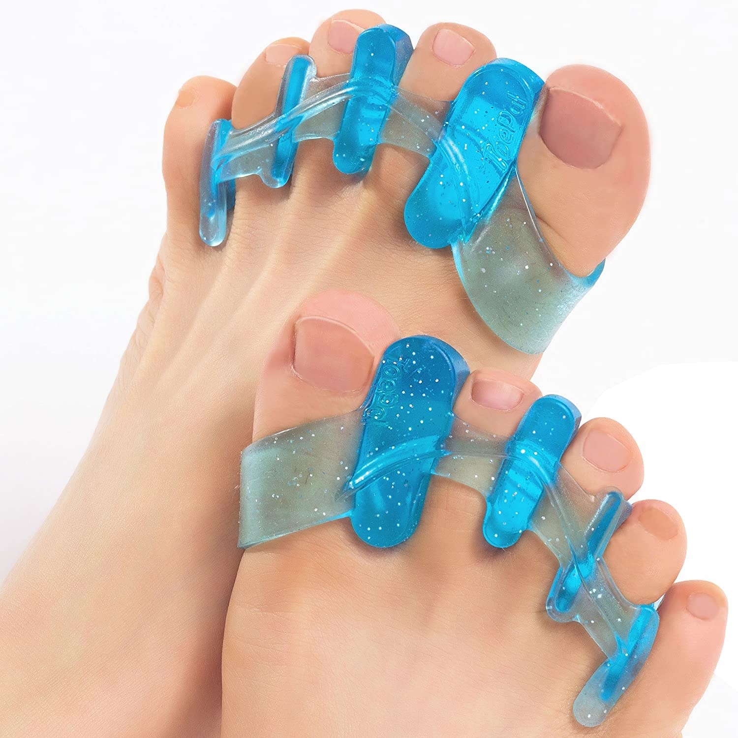 A person&#x27;s feet with toe separators between their toes