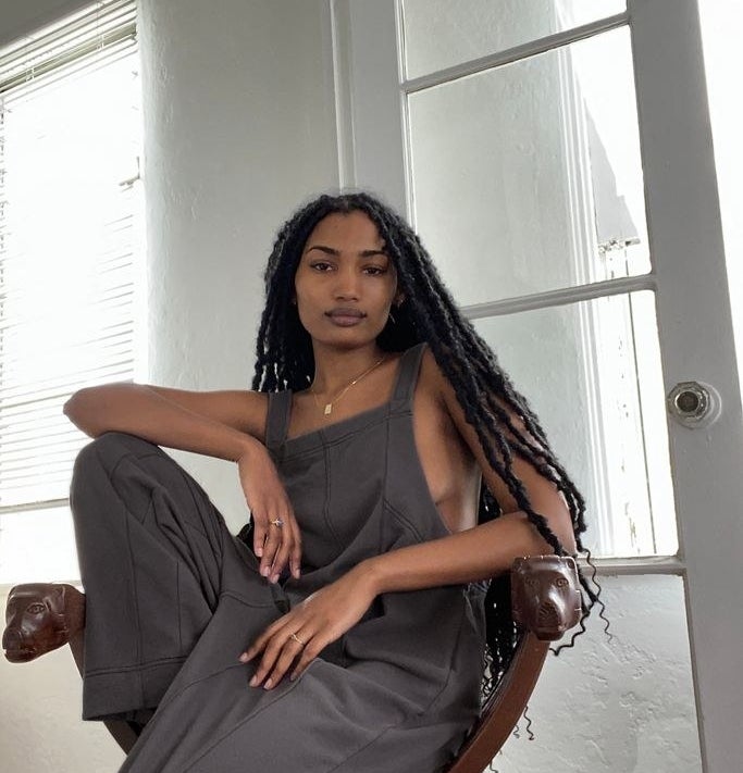 model wearing charcoal square neck jumpsuit