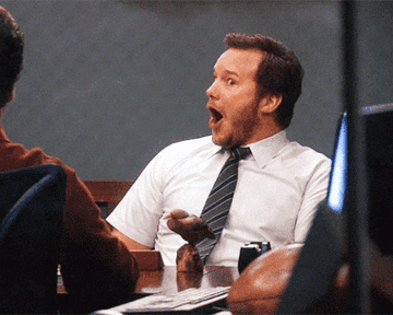 A gif of Chris Pratt in Parks and Recreation making a happy shocked face