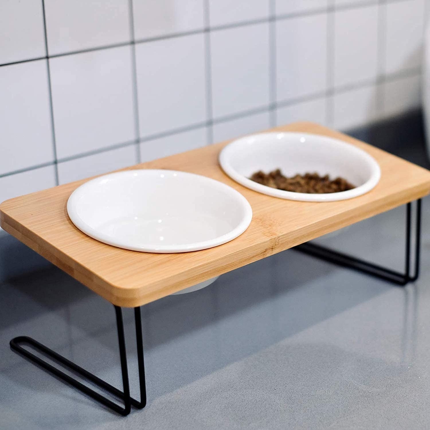 White bowls set inside natural wood table with black iron pipe legs 