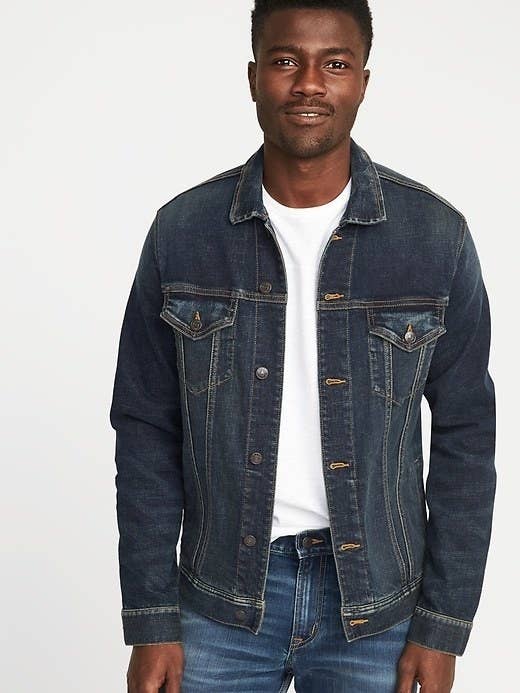 Model wearing the jacket over a white shirt