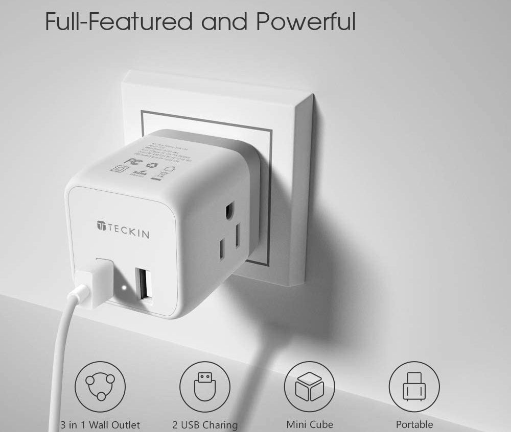 An outlet splitter plugged into a wall with various charging options