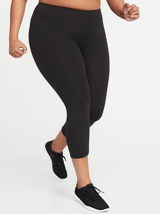 Model wears the leggings with black athletic shoes