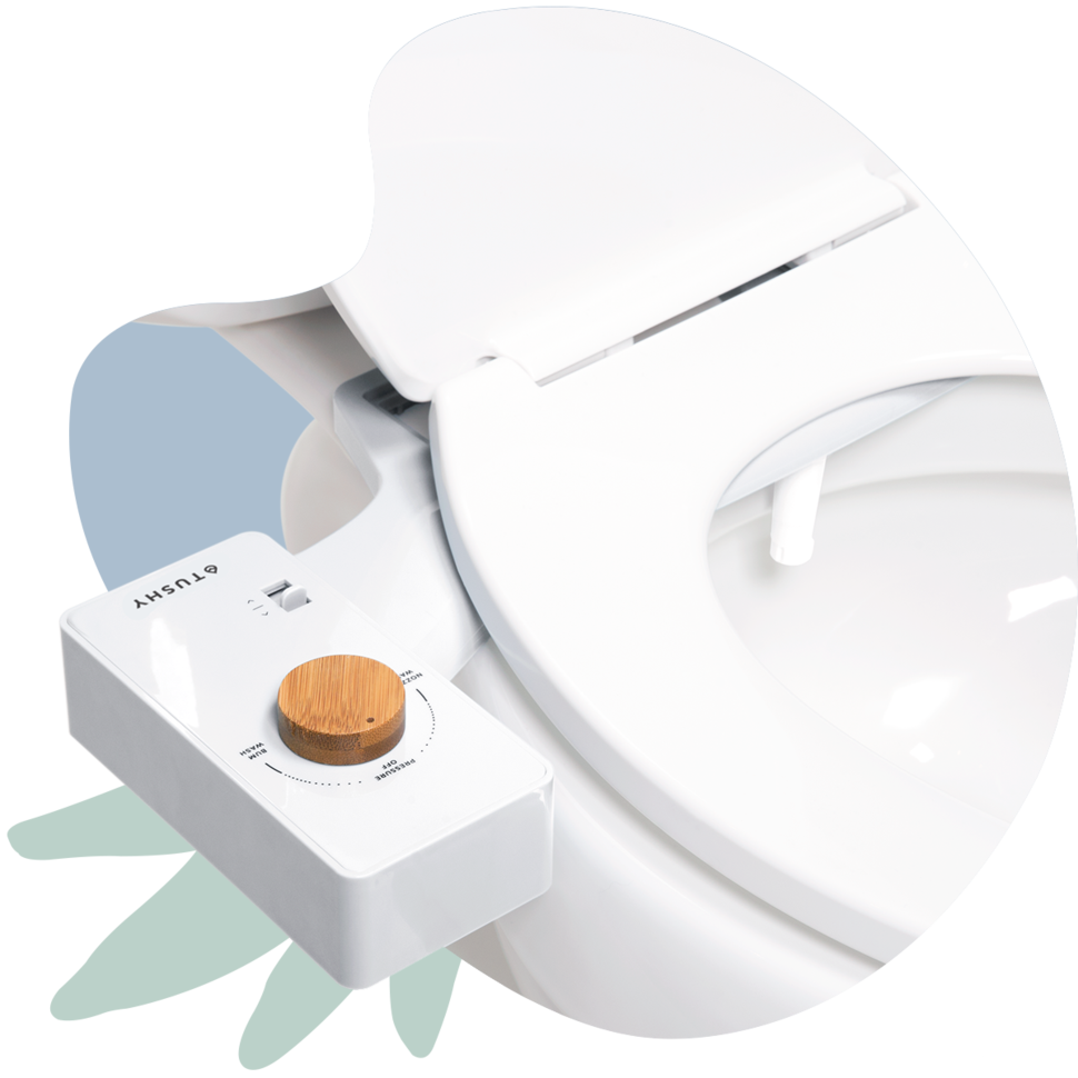 A white bidet attachment on a white toilet 
