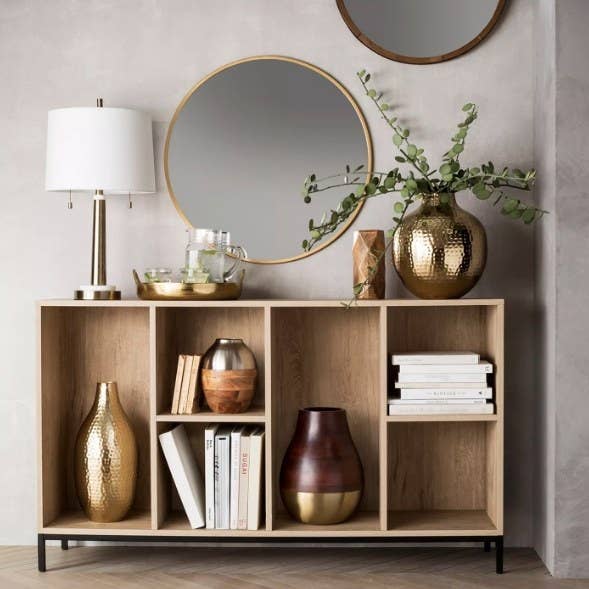 Round decorative wall mirror in entryway