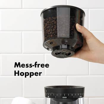 Image of a hand holding the hopper with the text 