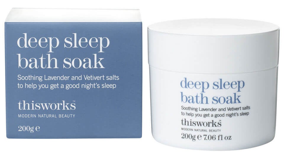 a blue box that says deep sleep bath soak on it in white next to a white container of the bath soak