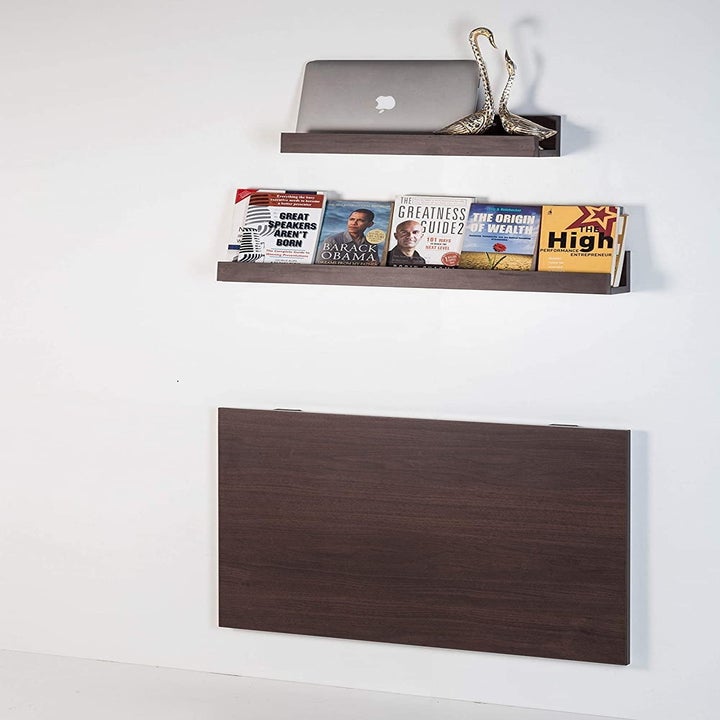 The desk pictured close, and flat, parallel to the wall.