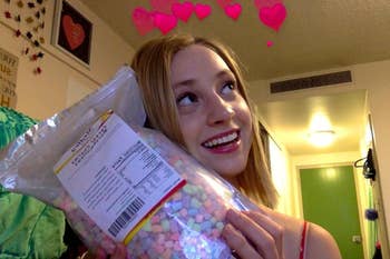 a reviewer smiling with the bag of marshmallows