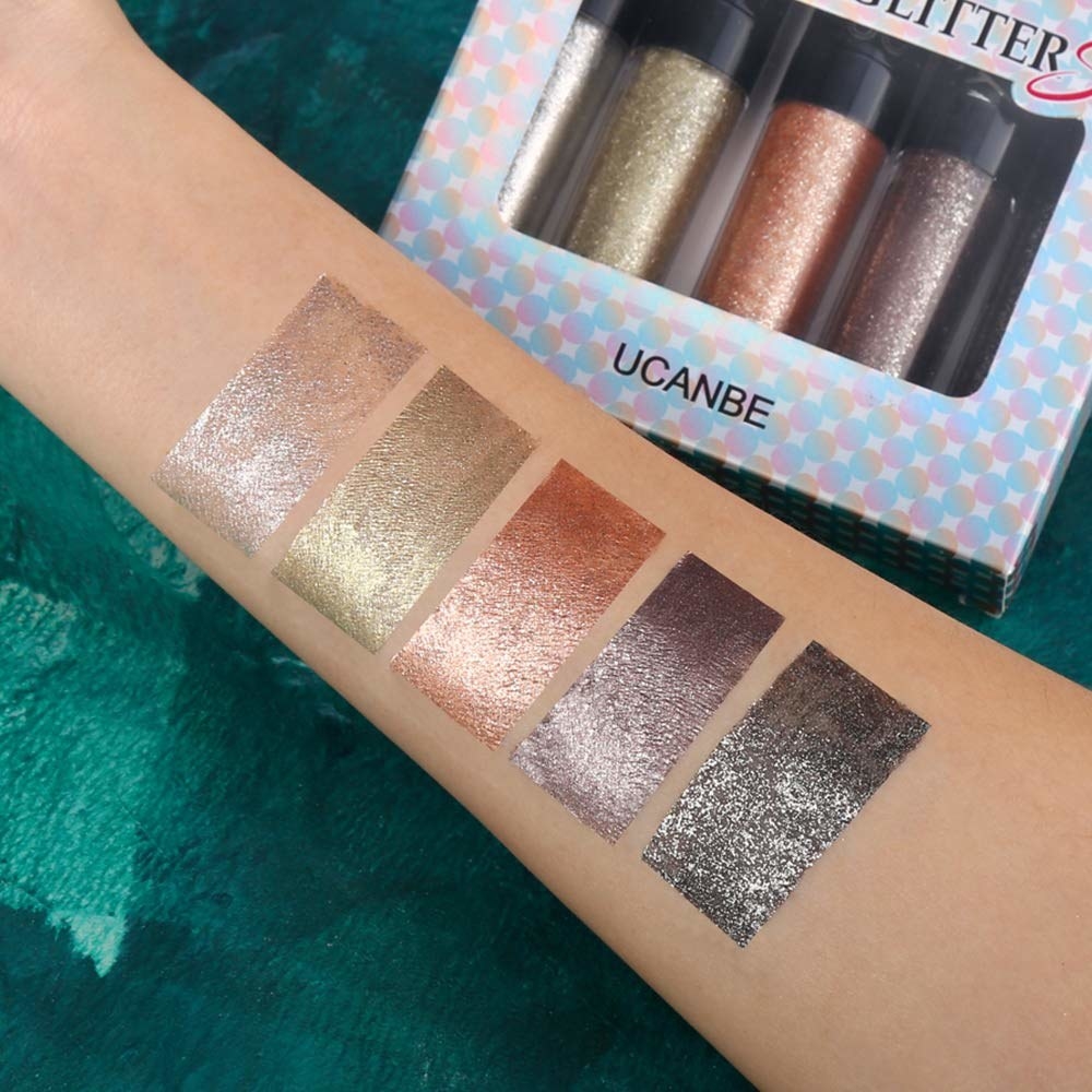 The silver, gold, rose gold, purple, and gunmetal shades swatched on an arm