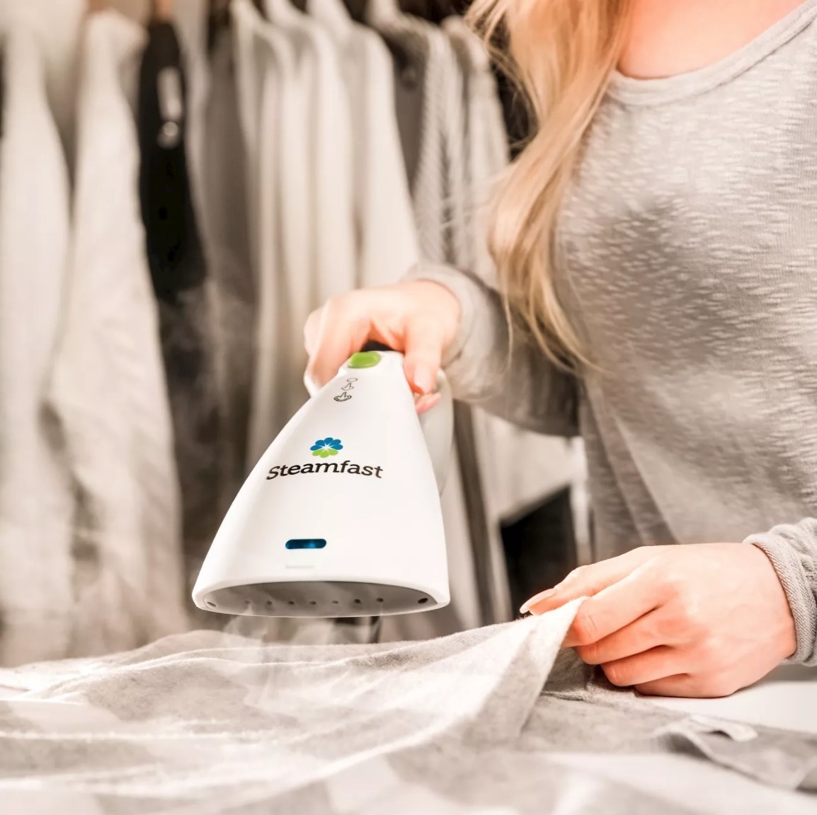 A steamer being used on fabric to quickly eliminate wrinkles