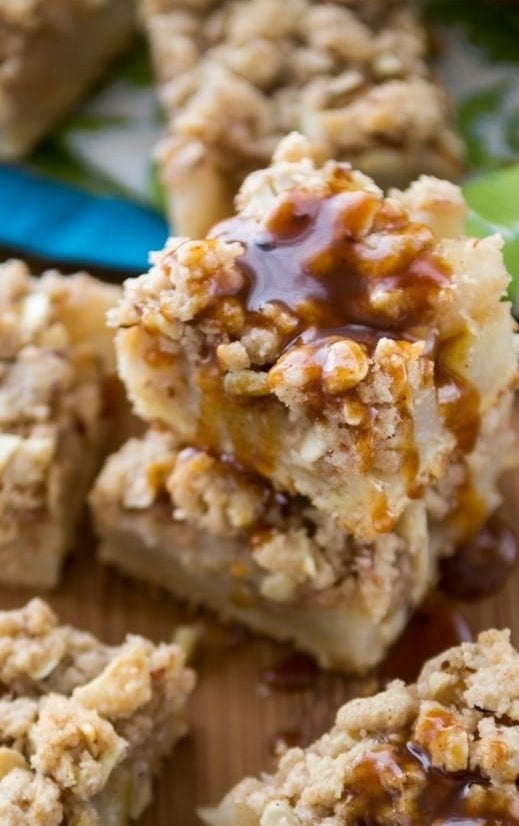 A stack of pear pie bars with a drizzle of caramel. 
