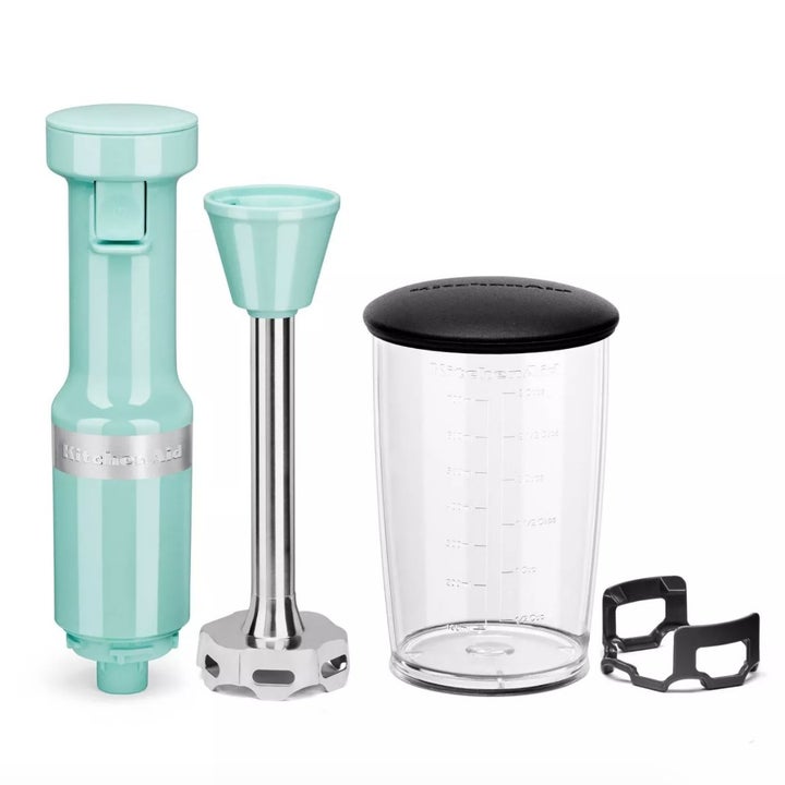 A turquoise blue immersion blender with plastic blending cup