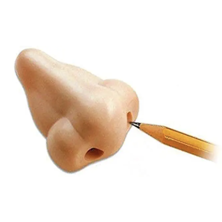 A pencil is put into a nostril on a nose that is actually a pencil sharpener