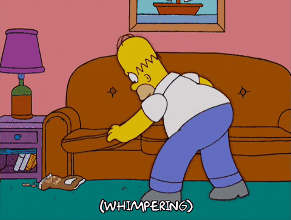 Homer from The Simpsons digging around a couch and whimpering 