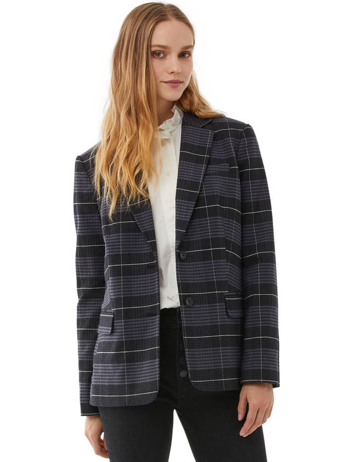 model wearing plaid grey blazer