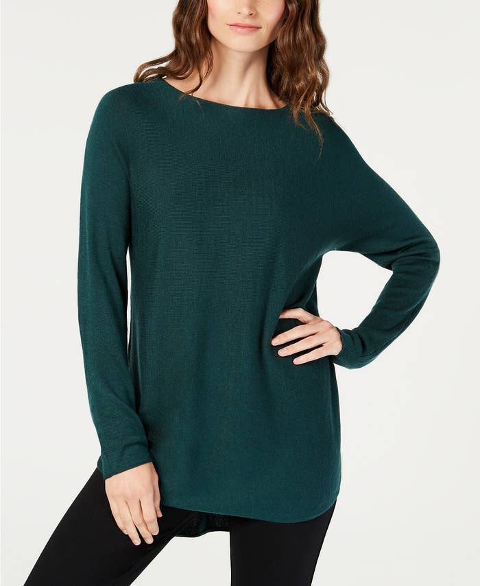 Model in the forest green colored sweater 