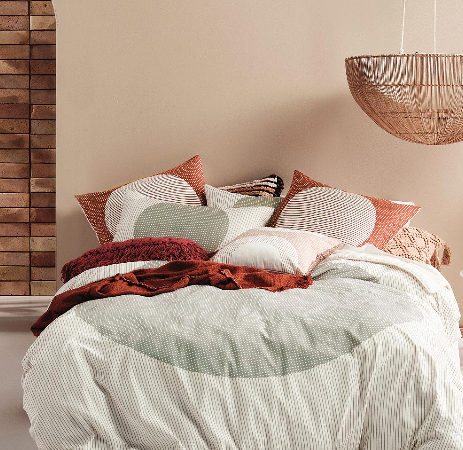 A duvet on a bed covered with pillows