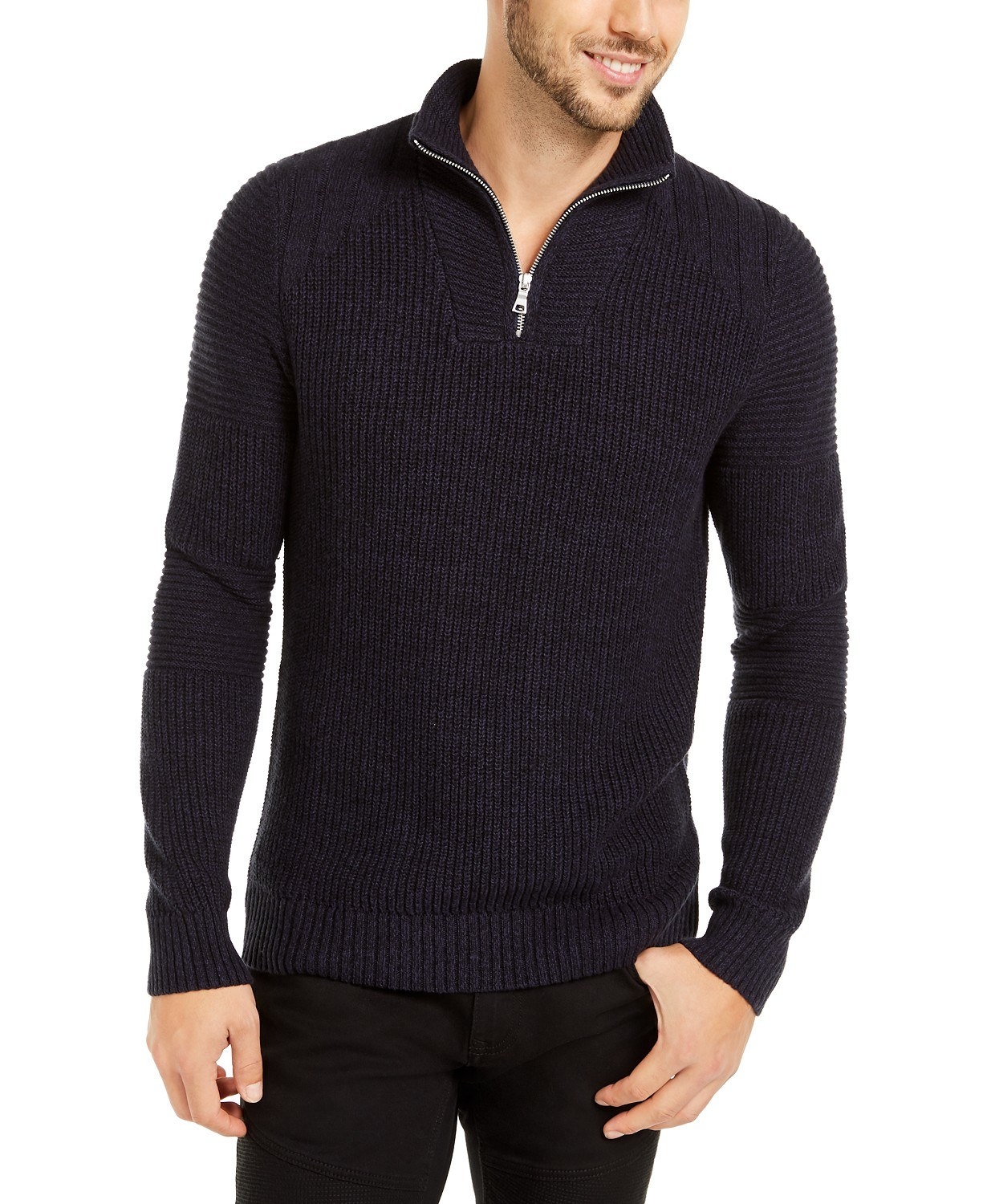 A model in a navy quarter zip sweater 