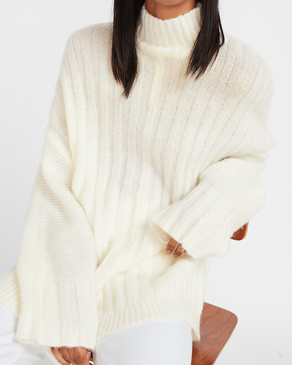 a model in the oversized ribbed white sweater