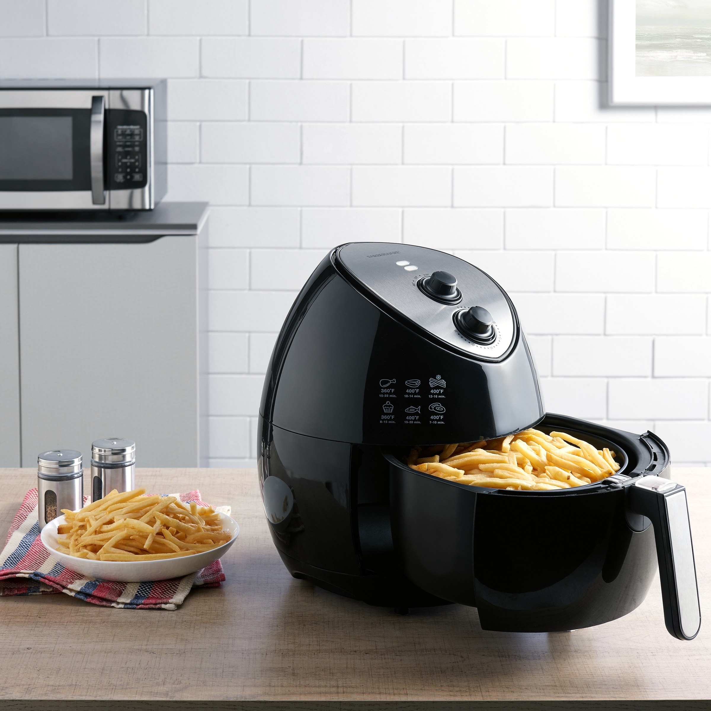 black farberware air fryer with fries in the cook basket