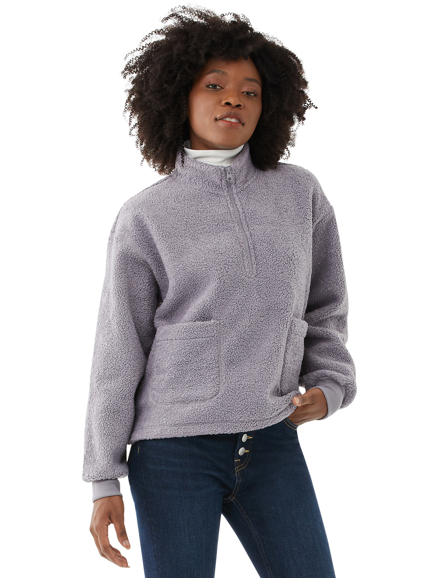 Model wearing a purple pullover with zipper