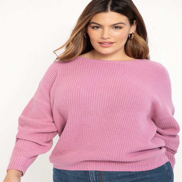 model in pink sweater