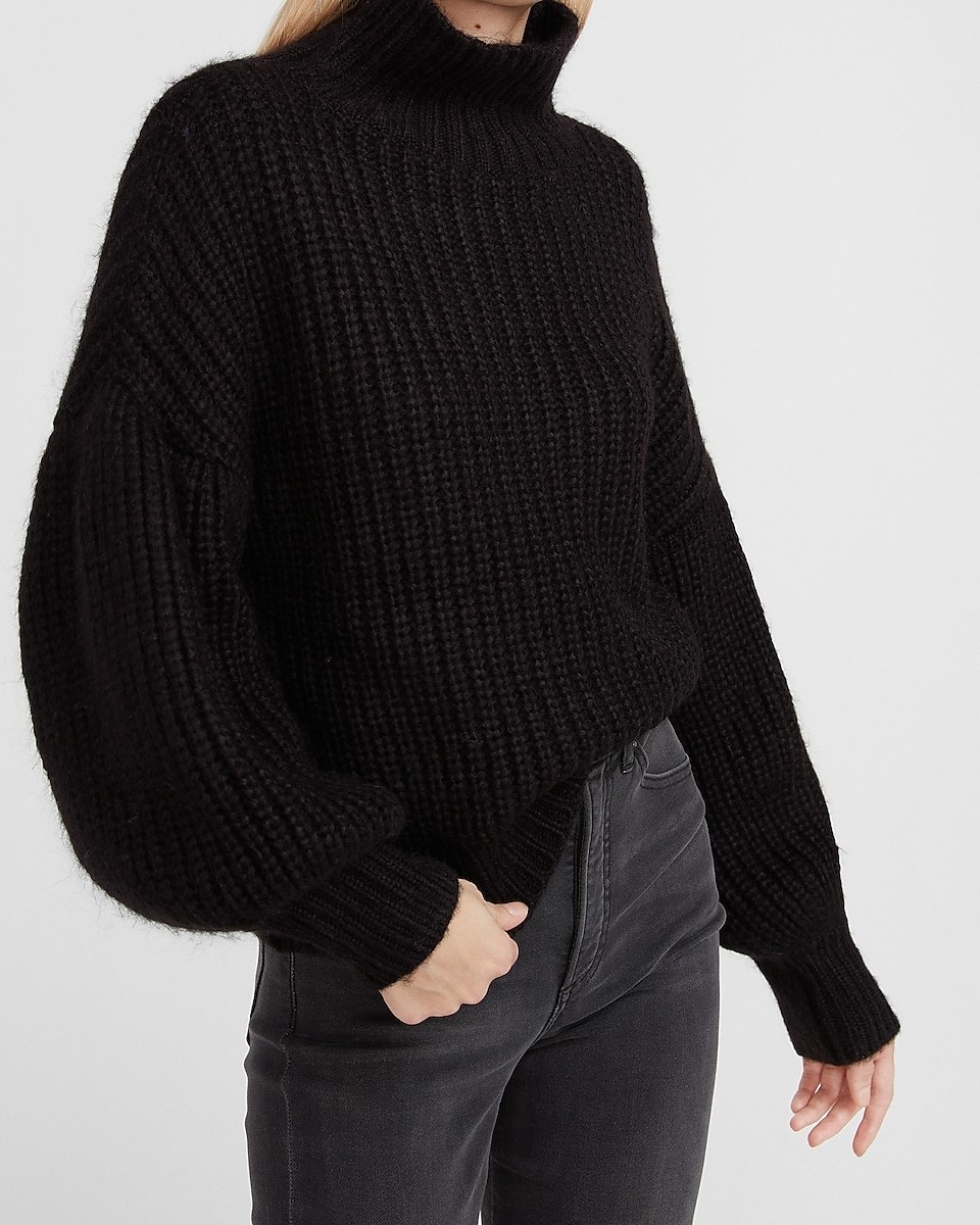 a model in the sweater in black