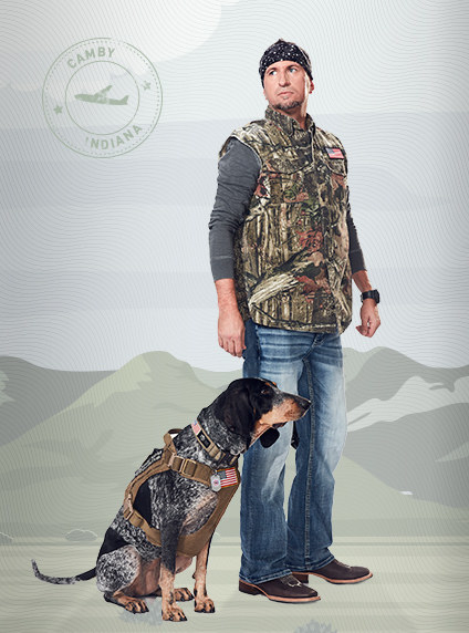 Dixie, a Bluetick Coonhound wearing a service dog vest, and Brian.