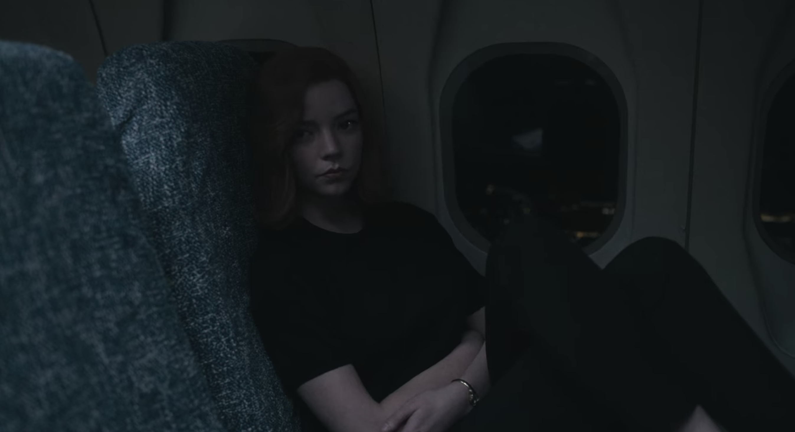 Beth awake during a flight