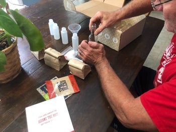 reviewer image of someone opening their hot sauce making kit