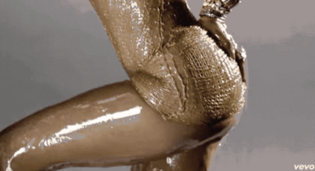 Jennifer Lopez all oiled up in a music video