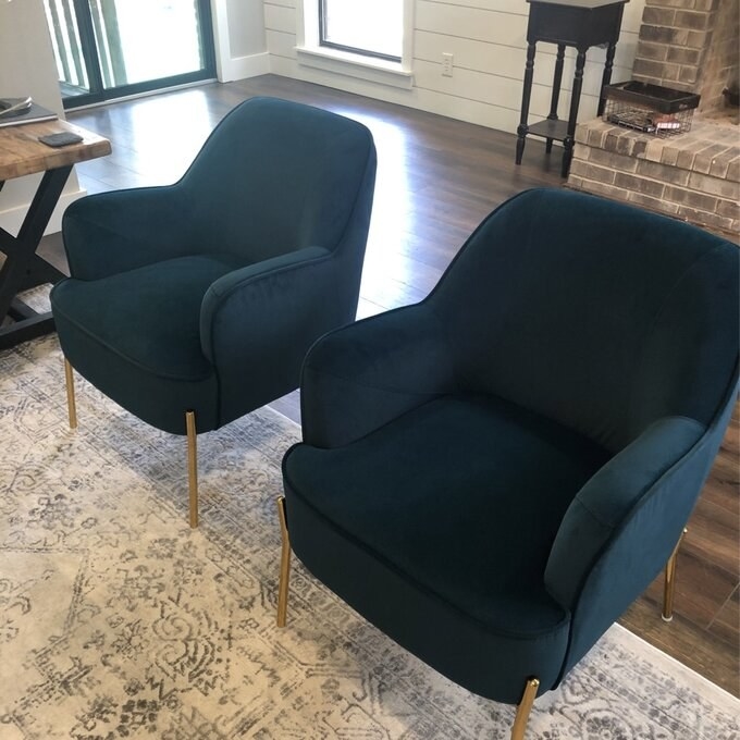 Reviewer's green velvet armchairs with gold chairs
