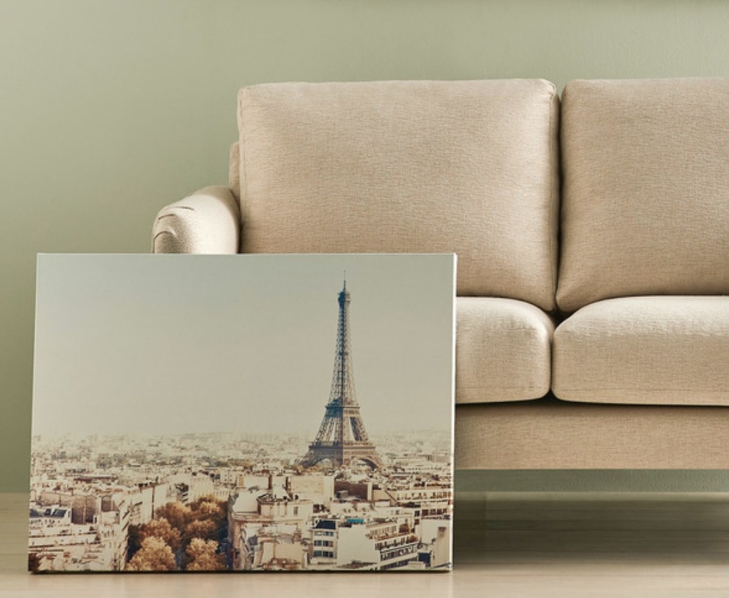 Canvas photo of the Eiffel Tower leaning against a couch 