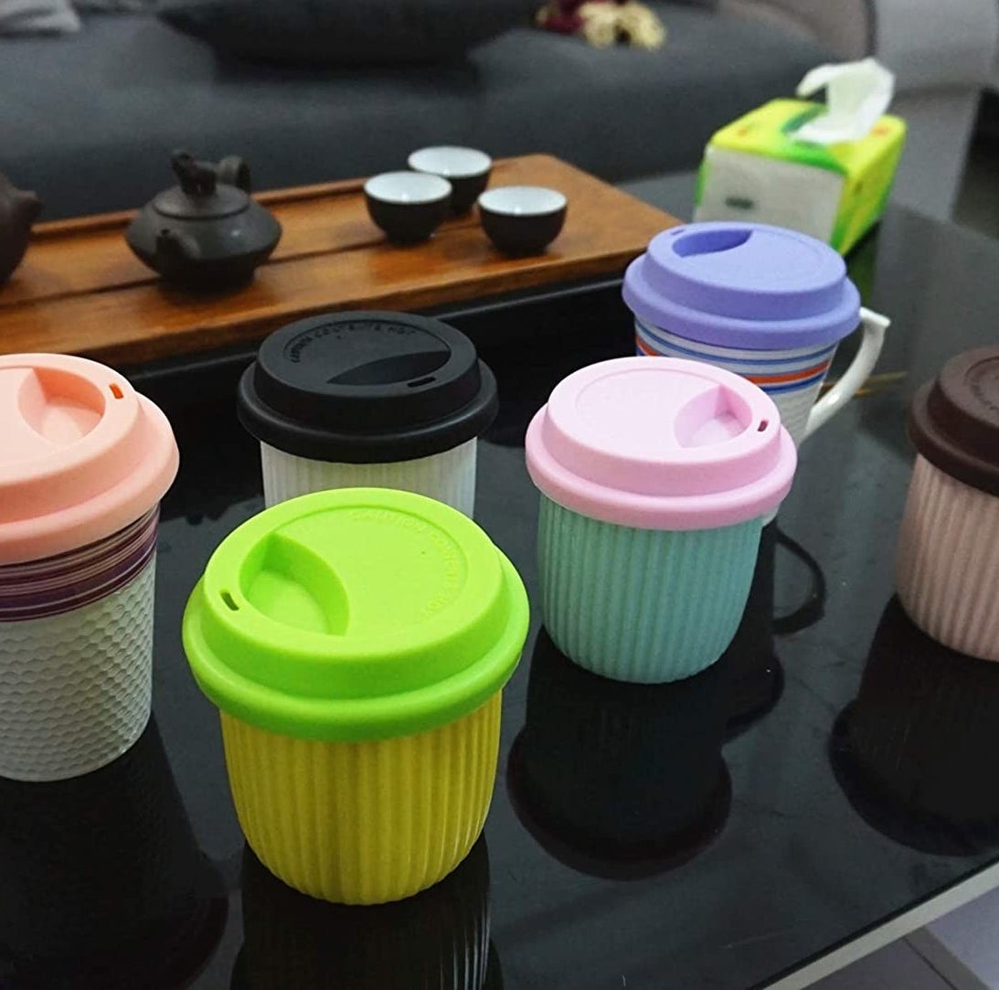 Silicone lids on several different mugs and cups