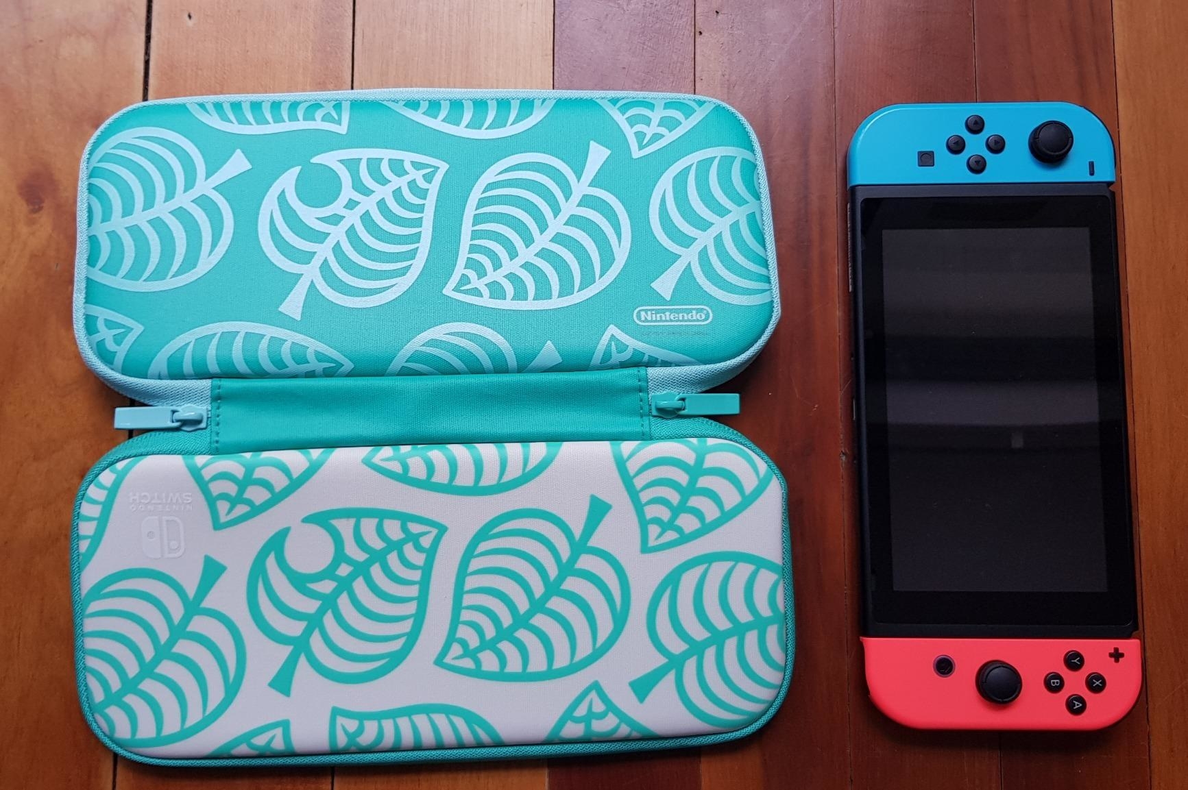 A turquoise case with a leaf print on it