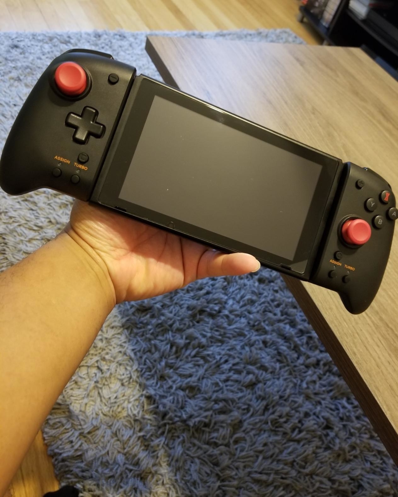 Reviewer holding their controller