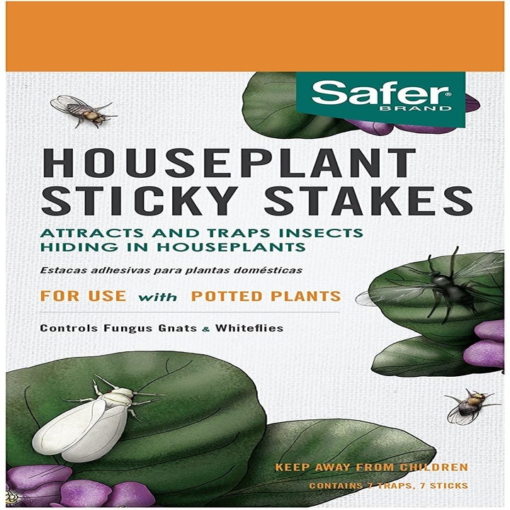 Packaging that read "Houseplant Stick Stakes, attracts and traps insects hiding in houseplants"
