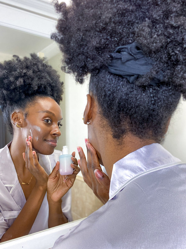 Essence applies her customized Function of Beauty moisturizer.