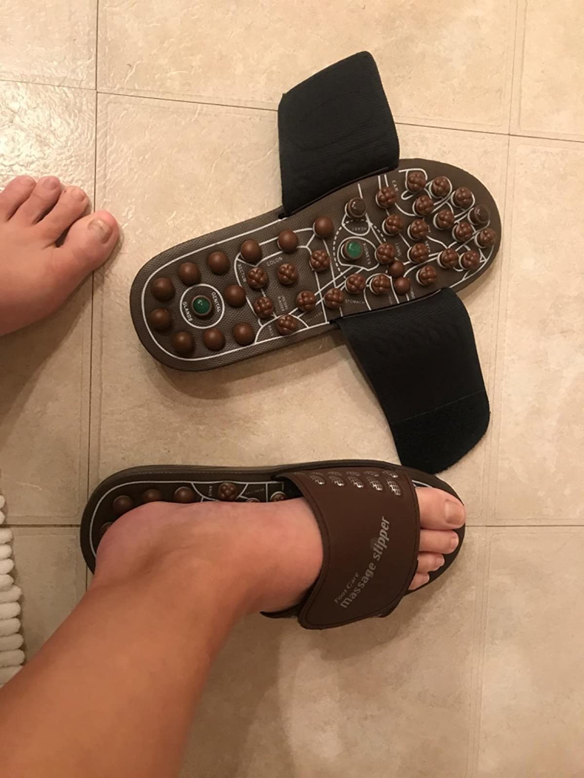 reviewer image of them wearing the shanlu foot massager sandals