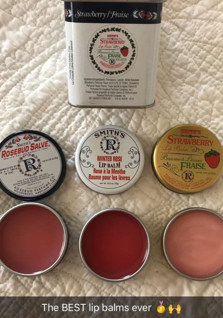 Three open tins of Rosebud Salve with a caption that reads &quot;The BEST lip balms ever&quot; 