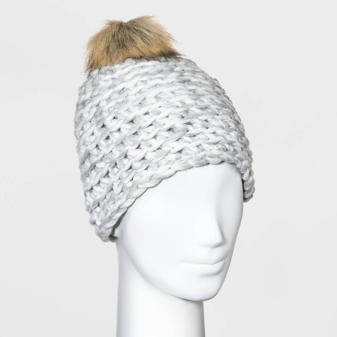 mannequin wearing a gray hand-knit pom beanie