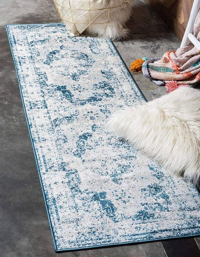 blue and gray vintage style runner on a bedroom floor