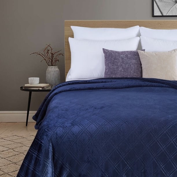 The blue blanket on a bed