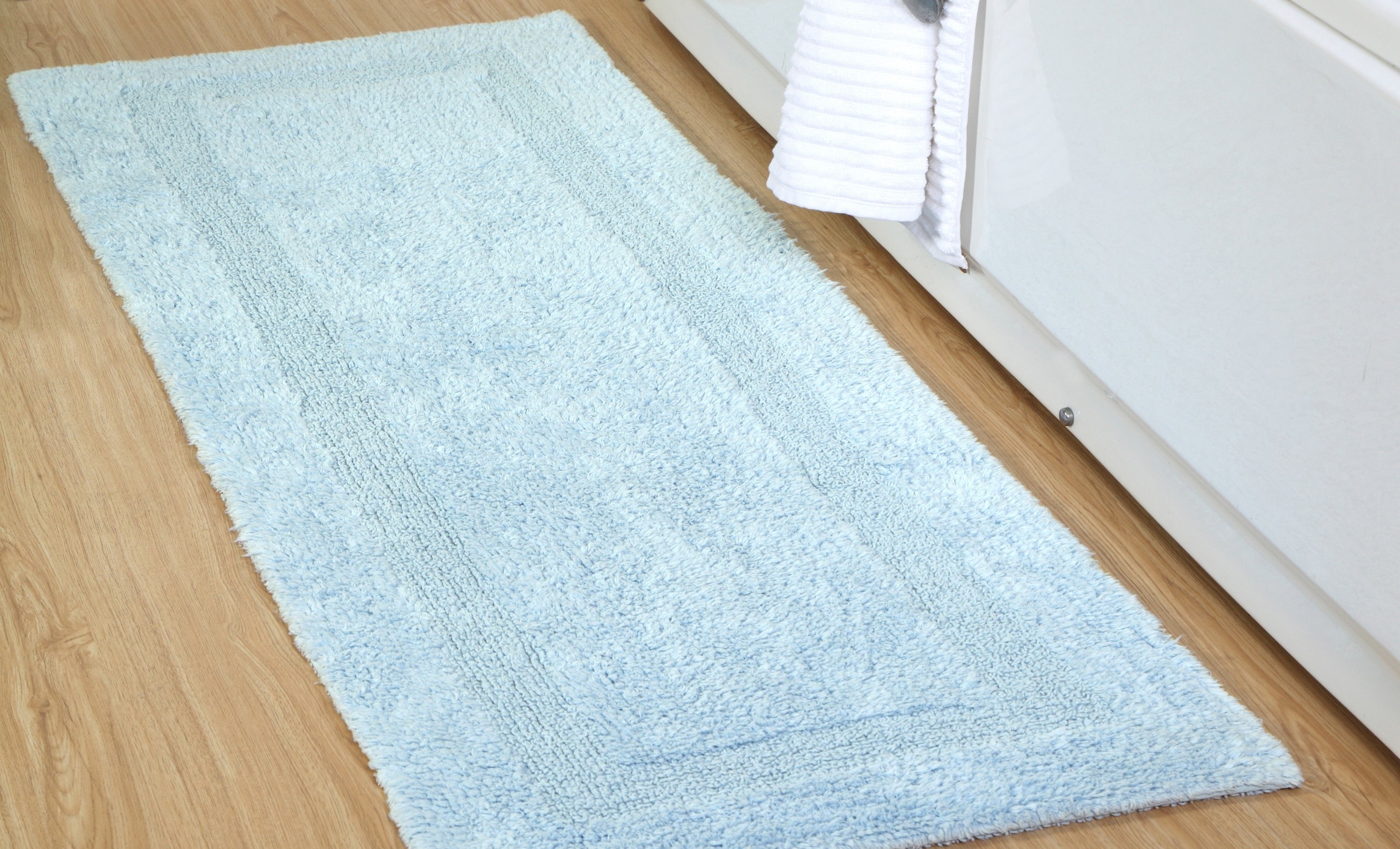 The blue mat on a wood floor