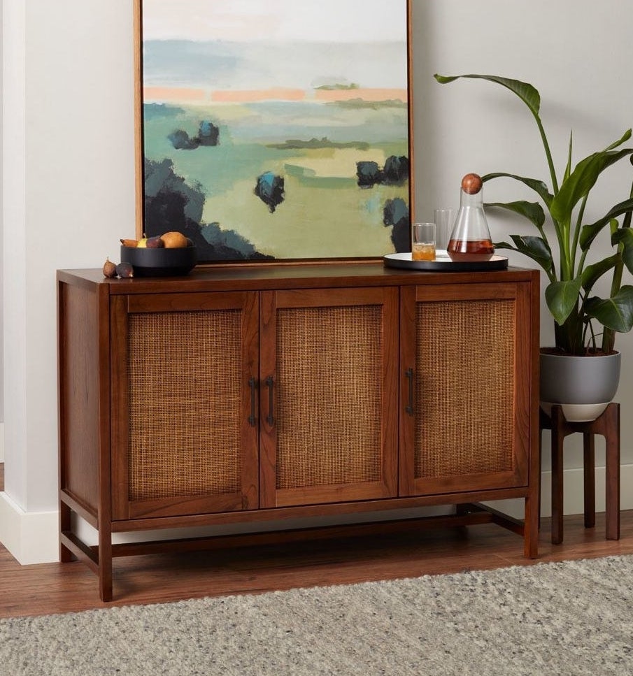 Wooden cabinet with 3 cane cabinet doors