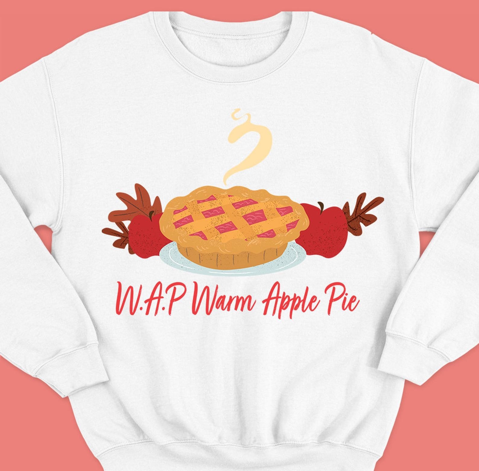 the sweater making a pun with Cardi B&#x27;s song WAP, where WAP here stands for &quot;Warm Apple Pie&quot; with art of an apple pie 